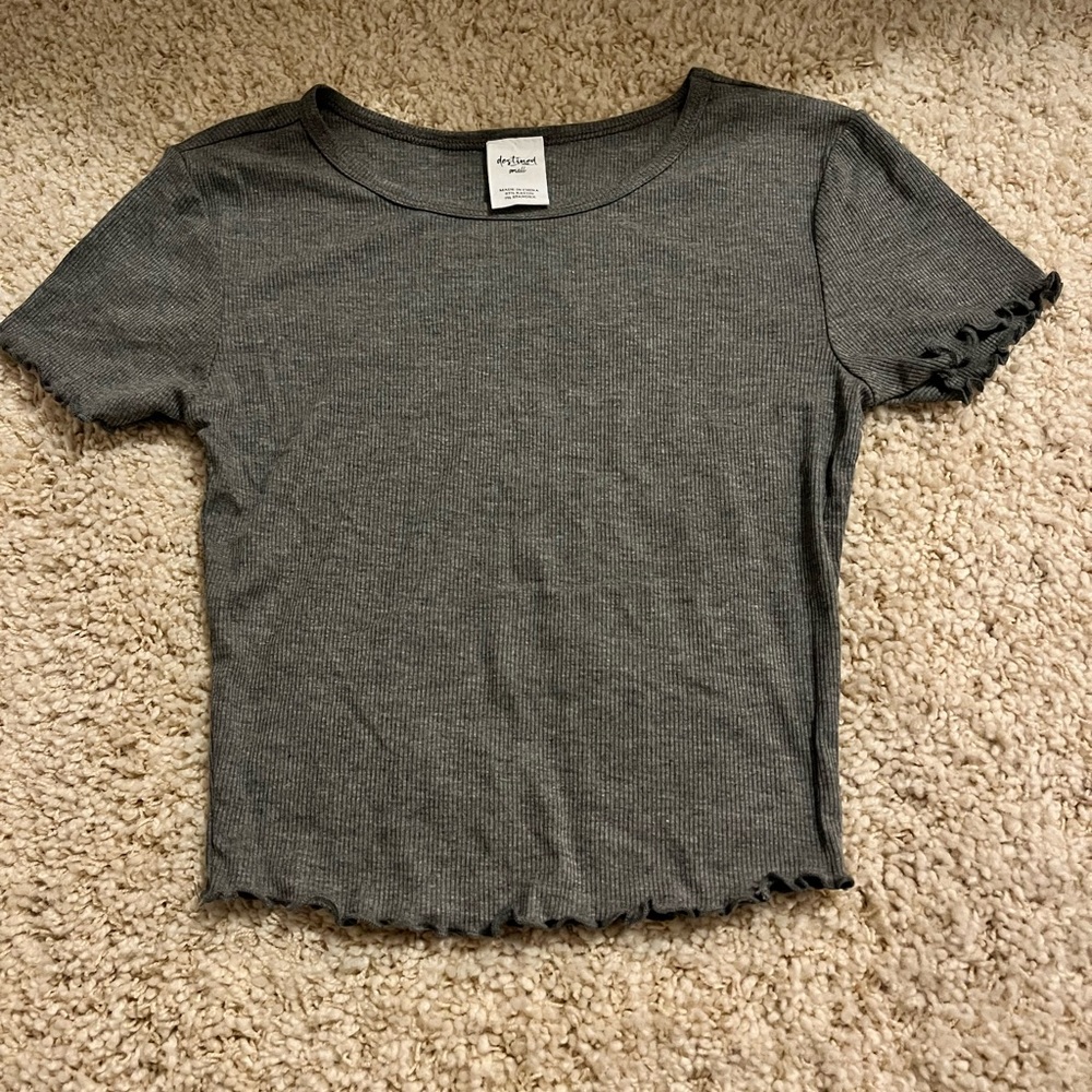 A gray cropped top.